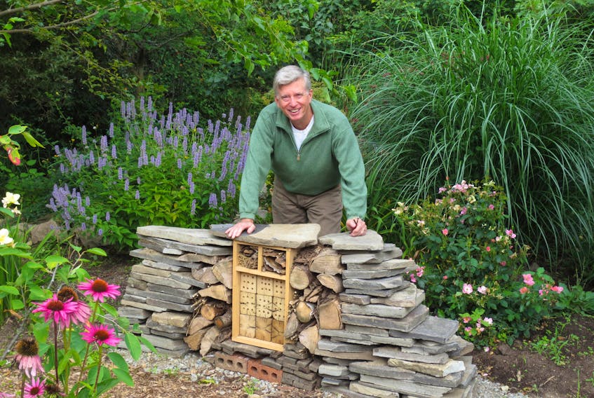 Mark Cullen with his insect hotel. Contributed photo. 