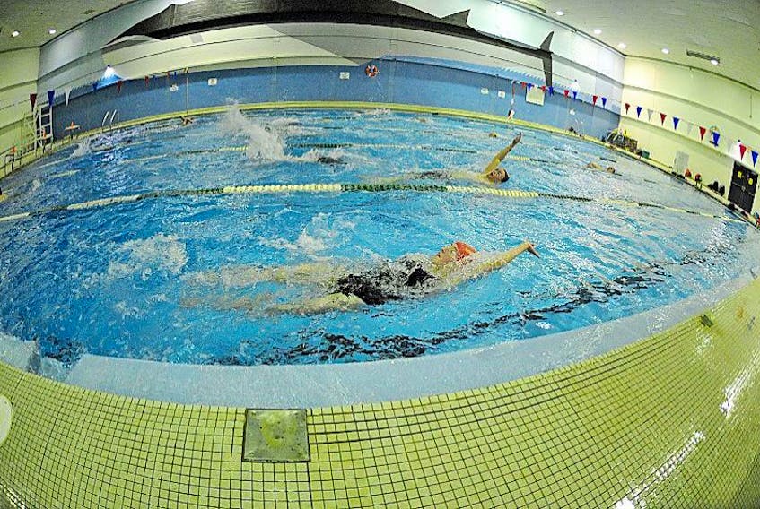GERALDINE BROPHY/THE WESTERN STAR<br />Corner Brook Rapids swim team members Caleigh Edwards, front, and Ronan Bull enjoy their last swim in the Grenfell Campus pool Thursday. The club held its final practice at the facility which is slated to close in a couple days.