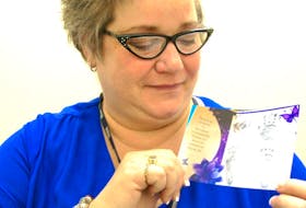 <span class="COLOURKicker">Tammy MacDonald of St. Andrews holds a photograph of the hand and feet prints taken from her grandson Marcel, who was stillborn in November. <br /></span>