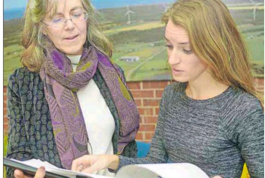 <span class="art-imagetext">Animal Justice executive director Camille Labchuk, right, and Atlantic Canada representative Elizabeth Schoales look over trapping regulations outlined in P.E.I.’s Wildlife Conservation Act following a meeting with Environment Minister Robert Mitchell on Monday.</span>