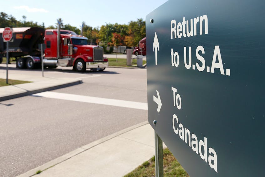 A truck leaves the Canada-United States border crossing at the Thousand Islands Bridge in Lansdowne, Ont. REUTERS File
