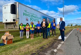 P.E.I. Premier Dennis King joined Tourism P.E.I. staff to welcome visitors as they drove off the Confederation Bridge with a variety of P.E.I. products to celebrate the opening of the Atlantic travel bubble on July 3. Government of P.E.I. Twitter photo