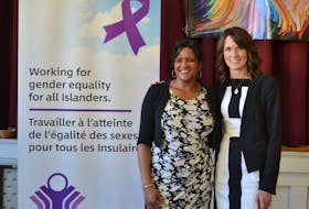 Debbie Langston, left, chairperson for the P.E.I. Advisory Council on the Status of Women and Education Minister Natalie Jameson, minister responsible for the status of women, take part in an event for International Women's Day in 2020. 
