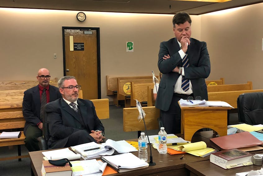 St. John’s Provincial Court Judge David Orr has heard a full week of testimony in the trial of elementary school principal Robin McGrath, seen here sitting behind his lawyers, Ian Patey (left) and Tom Johnson in the courtroom Friday. McGrath is facing multiple charges of assaulting and threatening children with special needs in 2017 and 2018.

