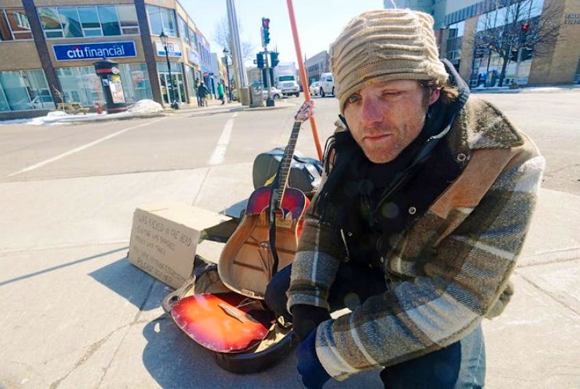 <span>Chris Nettleton has been busking daily at the corner of University Avenue<br /> and Kent Street in Charlottetown all winter. This past Sunday he claims<br /> two drunk men smashed his guitar, kicked him in the face, took his money<br /> and left. It is yet another setback in a troubled life for Nettleton.</span>
