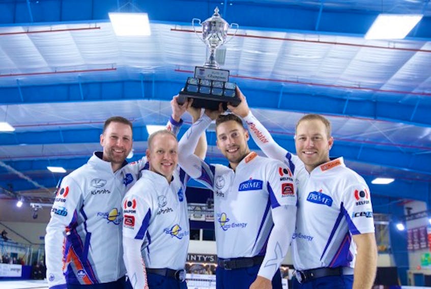 After winning the Elite 10 Sunday in Chatham, Ont., (from left) Brad Gushue, Mark Nichols, Brett Gallant and Geoff Walker raise the championship trophy.