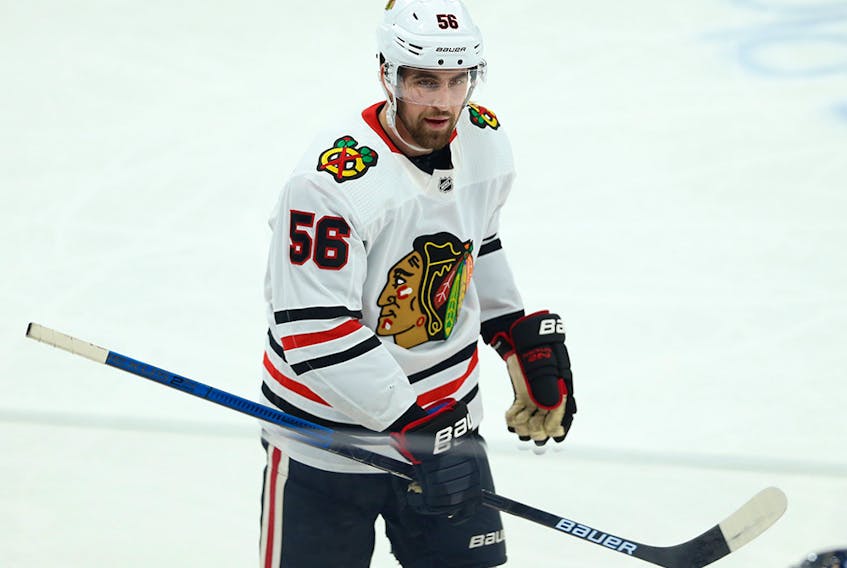  The Flames acquired defenceman Erik Gustafsson from the Chicago Blackhawks on Monday.