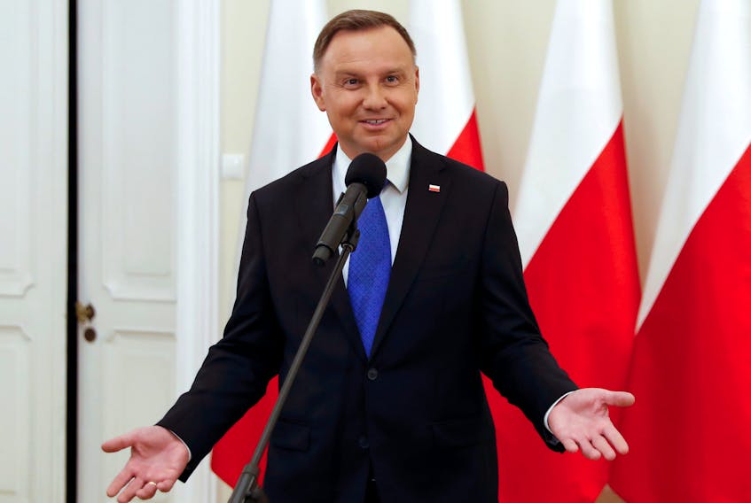 Polish President Andrzej Duda speaks to the media after initial poll results indicating he won re-election in a run-off vote, in Warsaw, Poland, July 12. — REUTERS/Aleksandra Szmigiel/File Photo