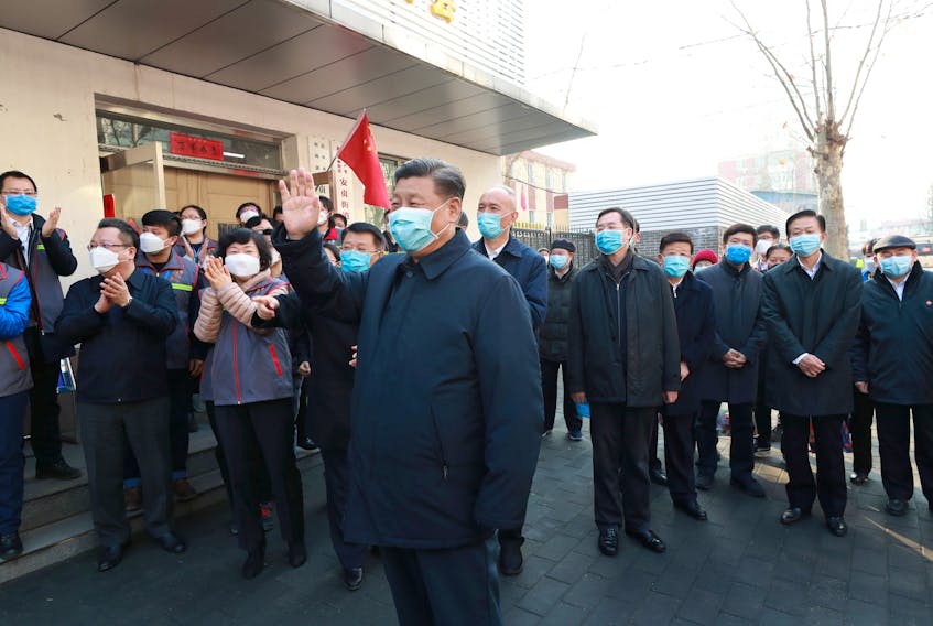 Chinese President Xi Jinping inspects coronavirus prevention and control work at Anhuali Community in Beijing, China, Monday. — Xinhua via Reuters

