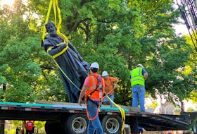 A Christopher Columbus statue is removed in Tower Grove Park, St. Louis, Missouri, in this June social media photo. Last week, a different statue of Columbus was thrown into Baltimore, Md., harbour. REUTERS