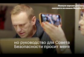 Russian opposition politician Alexei Navalny is seen during a phone call, when he had tricked a secret agent into disclosing details of the botched plot to kill him, at undisclosed location in Germany, on this still image obtained from video, December 21, 2020. NAVALNY.COM/Social Media via REUTERS