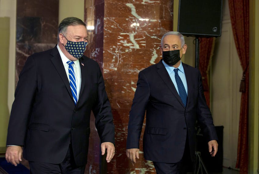 U.S. Secretary of State Mike Pompeo (left) and Israeli Prime Minister Benjamin Netanyahu leave after making a joint statement in Jerusalem, Nov. 19, 2020. — Maya Alleruzzo/Pool via Reuters 
