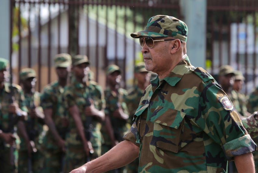 Suriname’s President Dési Bouterse reviews the troops during a ceremony at the Memre Buku military barracks, in Paramaribo, Suriname, In March 2019. This week Bouterse lost the election and may be headed to jail on a previous murder conviction. — Reuters