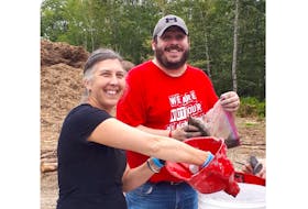 Stacey Harrison, executive director at the Colchester-East Hants Hospice Society, and Mike Francis, program support coordinator, recently spent some time on Oak Island, packing soil samples for a fundraiser. The money will go toward the society and the Health Services Foundation of the South Shore.