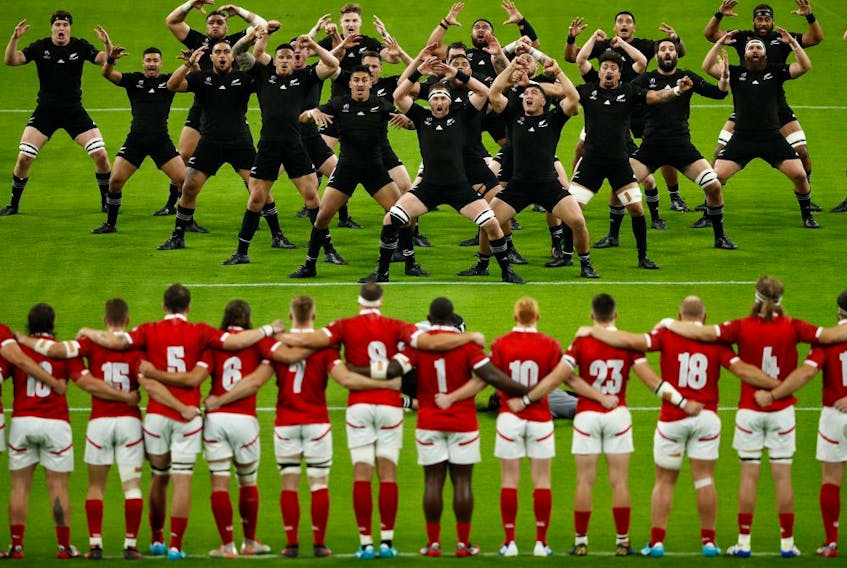 New Zealand players perform the Haka dance in front of Canada players before a Rugby World Cup match on Oct. 2, 2019, in Oita, Japan. (EDGAR SU/Reuters)