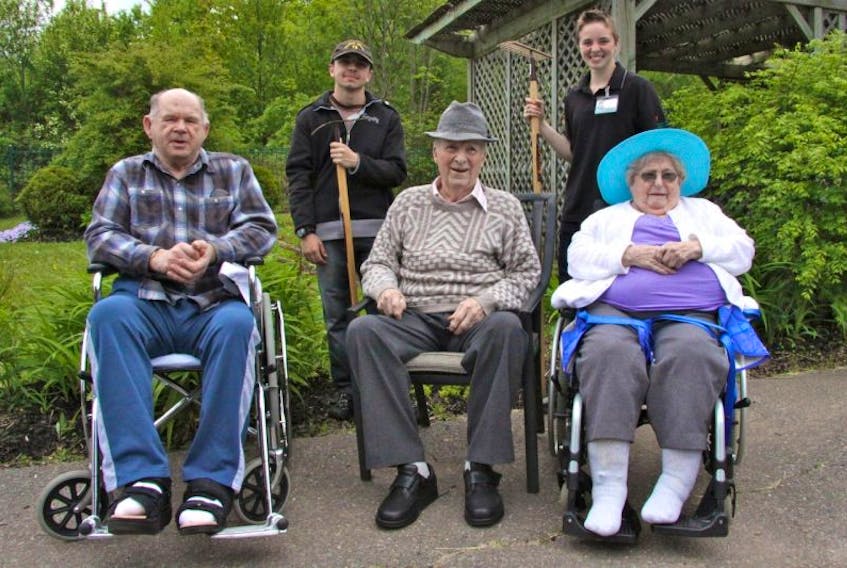 <p>O2 students Brandt Eldridge and K.L. McGibbons helped celebrate the revived gardens at Haliburton Place with residents, from left, Melvin Hayes, Donald Sanford and Ida Marie Rose.</p>