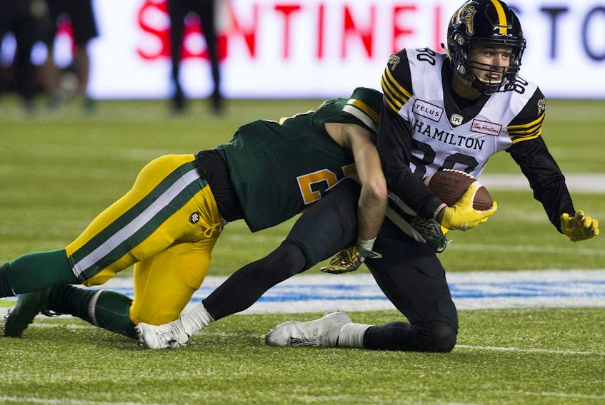 The Hamilton Tiger-Cats' quarterback Dane Evans battles the Edmonton Eskimos during first half CFL action at Commonwealth Stadium, in Edmonton Sept. 20, 2019. (David Bloom/Postmedia Network files)
