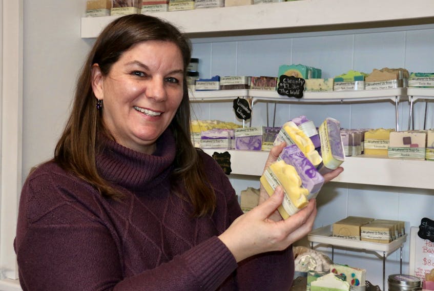 Trisha Lowthers, the founder of All Lathered Up Soap Company, enjoys the creative process in making new bath and body products.