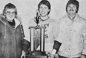Troy Benedict, a Valley Jets forward, received the 1986 Gerald Davis Memorial Trophy. Presenting the trophy were Mary and Earl Davis.