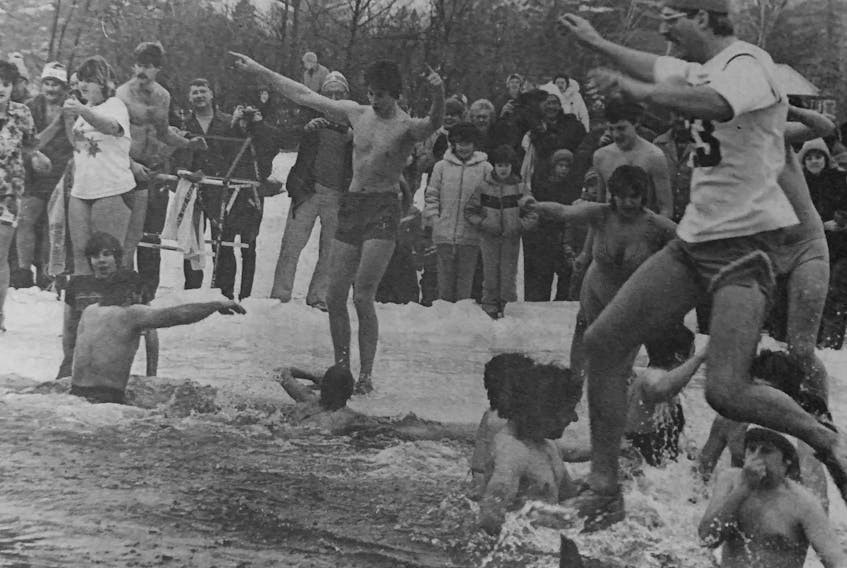 Dozens of people braved the icy waters of Zwicker Lake in 1986. 