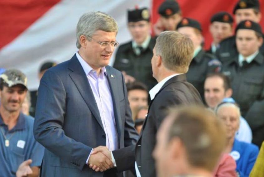 Prime Minister Stephen Harper shakes the hand of Cumberland Colchester Musquodoboit Valley MP Scott Armstrong during a visit to Amherst in August 2012.