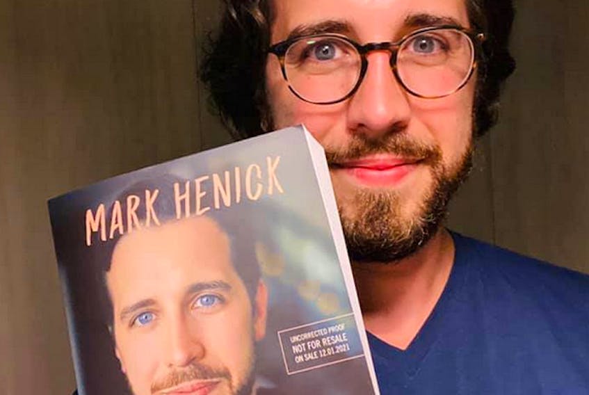 Mental health advocate Mark Henick is shown with a copy of his first book, “So-Called Normal,” to be published by Harper Collins in January 2021. CONTRIBUTED/Facebook
