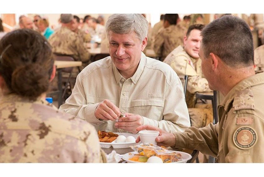 <span>Prime Minister Stephen Harper joins Canadian Armed Forces members stationed in Kuwait for breakfast during his visit to Kuwait.</span>