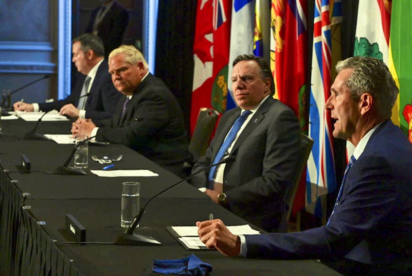 Manitoba Premier Brian Pallister, right, speaks during a press conference in Ottawa alongside Quebec Premier Francois Legault, Ontario Premier Doug Ford, and Alberta Premier Jason Kenney on Friday, Sept. 18, 2020.