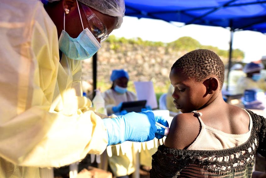  A Congolese health worker administers ebola vaccine to a child at the Himbi Health Centre in Goma, Democratic Republic of Congo, earlier in July.