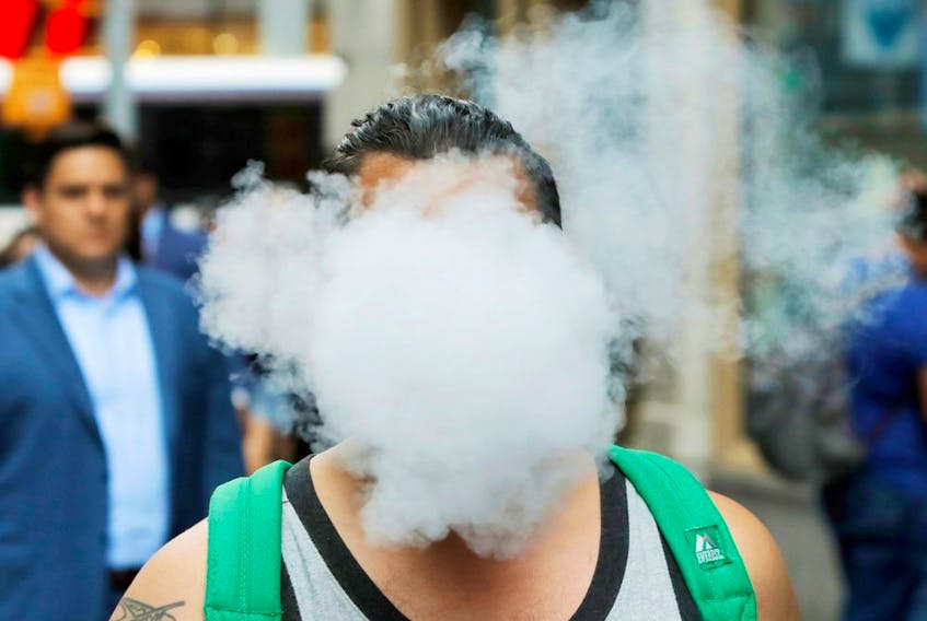 A man uses a vape as he walks on Broadway in New York City, U.S., September 9, 2019. "According to the U.S. Centers for Disease Control and Prevention (CDC), there are currently six deaths and 380 confirmed or probable cases of severe lung disease due to vaping," Christopher Labos writes.