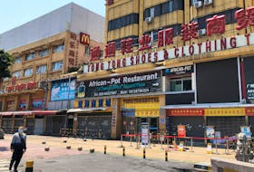 An African restaurant is closed off along with other businesses in Guangzhou's Sanyuanli area, where a neighborhood is in lockdown after several people tested positive for the novel coronavirus disease (COVID-19),  in Guangdong province, China April 13, 2020.