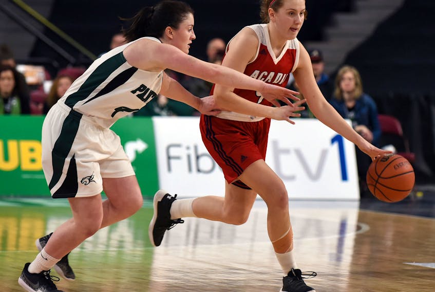Acadia's Jayda Veinot, right, who suffered a concussion in November, is back at full health for the two-time defending AUS champion Axewomen, who have one regular-season game remaining.   JOEY SMITH / Truro News
