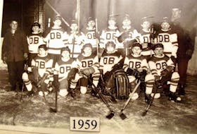 The 1959 Don Bosco hockey team is shown, in front and from the left, Blaise MacNeil, Ray Drohan, William Tetanish, Joe Ryba, Angus MacNeil, Frank Starzomski, and Buddy Dalton, coach/teacher. In back, from the left, are John Paruch, manager, Wilfred MacCormack, Peter Melnick, Edward Fewer, David Legge, Ray MacKinnon, Moe Brygidyr, David O'Keefe, Arthur Pittman. The team played in the Sydney Rotary Common School Hockey League. (Courtesy of Frank Starzomski) 