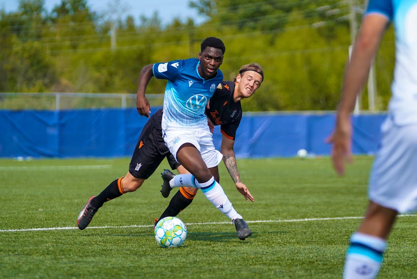HFX Wanderers FC’s Daniel Kinumbe avoids a Forge FC player during a CPL Island Games playoff match on Wednesday in Charlottetown. The Wanderers take on Cavalry FC in their second game of the Group Stage on Saturday.  (Chant Photography)