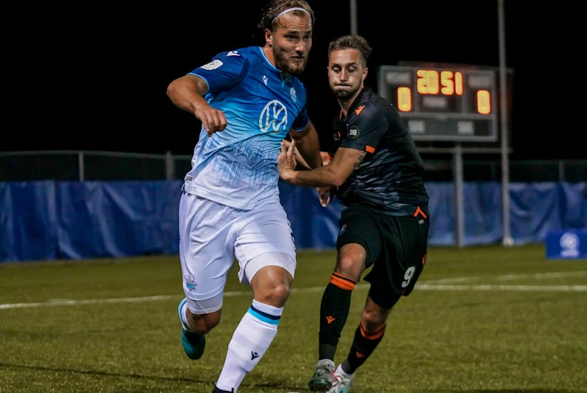 HFX Wanderers’ Peter Schaale, left, battles for the ball with a Forge FC player in Canadian Premier League action. The Wanderers play Valour FC in a key matchup on Wednesday in Charlottetown. Chant Photography