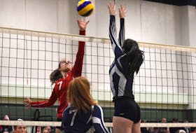 Madeleine LeVert of the Riverview Royals, left, tries to score as Christiane Verstege of the Charles P. Allen Cheetahs attempts to block during 2019 Nova Scotia School Athletic Federation Division 1 girls' volleyball provincial championship action at Memorial High School in Sydney Mines. (JEREMY FRASER/CAPE BRETON POST)