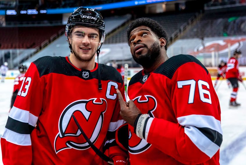 New Jersey Devils defenceman P.K. Subban points at the C on new team captain Nico Hischier's jersey. (NEW JERSEY DEVILS)