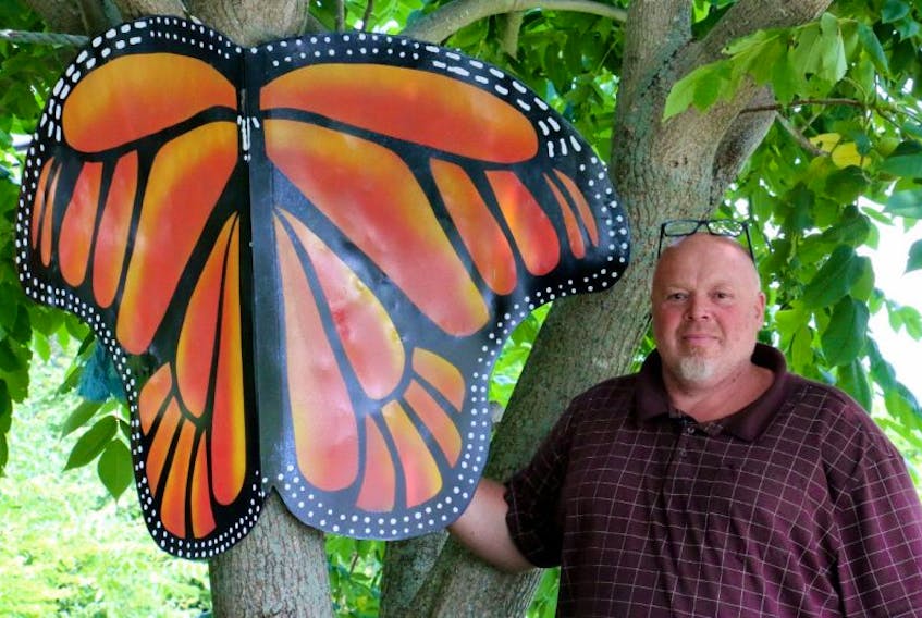 Al Mailman, owner and operator of Unique Things Wanted, creates all sizes of whimsical works of art from his home in Falmouth, including this five-foot butterfly.