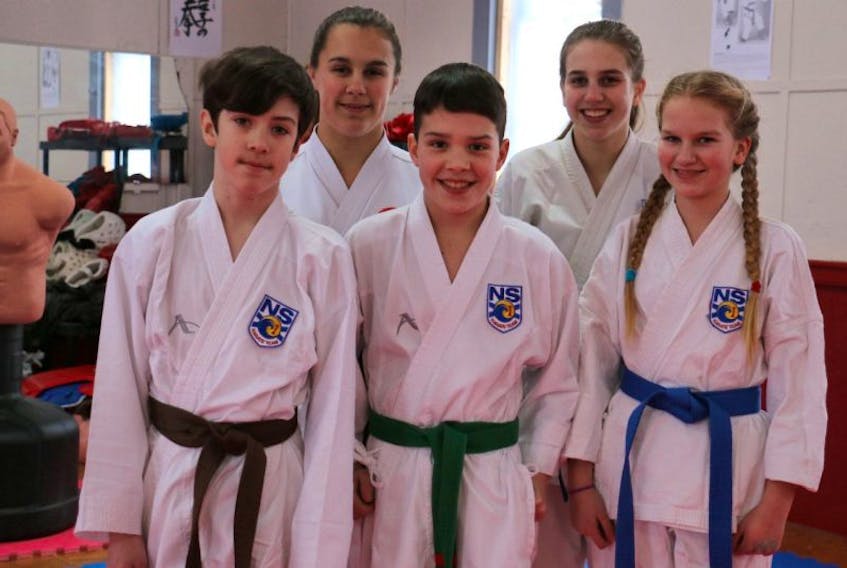 Windsor Karate Club members, from left, back row: Maddison Hollett and Angel Niet; front row: Aiden Postma, Alex Lyghtle and Jesse Niet are ready to head to nationals later this month.