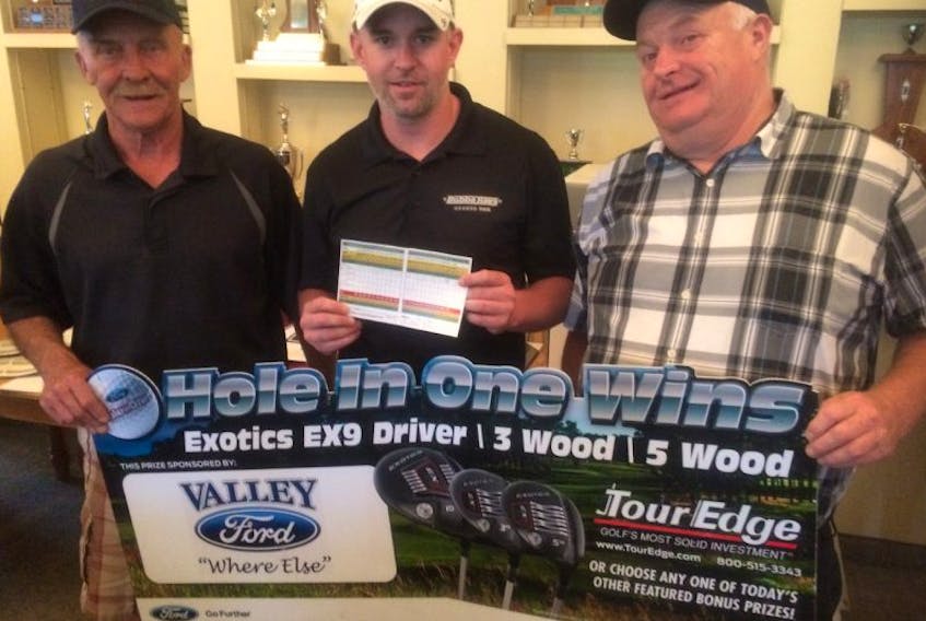 Representatives with the Valley Maple Leafs, Bob Dill, left, and Randy Graham, right, congratulated Adam Ullock on getting a hole-in-one during their golfing fundraiser recently.