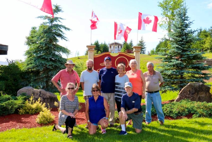 Residents of The Crossing are pleased with their Canada Day community-wide decorating and hope people will visit to see how proud they are to call Canada home. Pictured here are, from left, back row: Eloi Gaudet, Bob Spence, Bill Kelly, Joan Blank, Selina Kelly, and Earle Dodge; front row: Peggy Chiasson, Nancy Trenholm, and Barrie Blank.