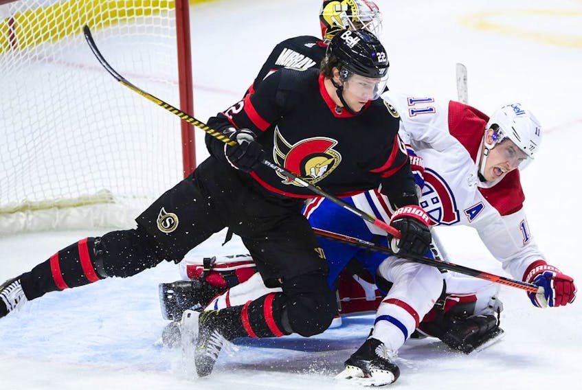 Ottawa Senators defenceman Nikita Zaitsev (22) checks Montreal Canadiens right wing Brendan Gallagher (11) during third period NHL action in Ottawa Feb. 23, 2021.