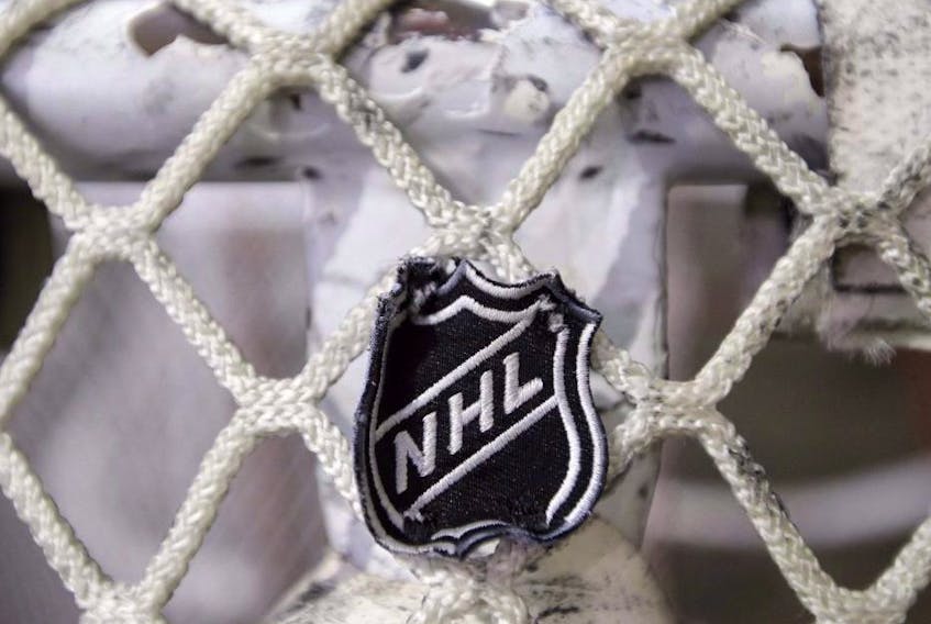 The NHL logo is seen on a goal at a Nashville Predators practice rink in Nashville, Tenn. 