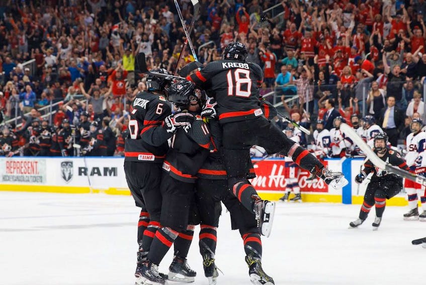 Canada celebrates the game-tying goal during third period Hlinka Gretzky Cup semifinal action against the United States, in Edmonton on Friday, August 10, 2018.
