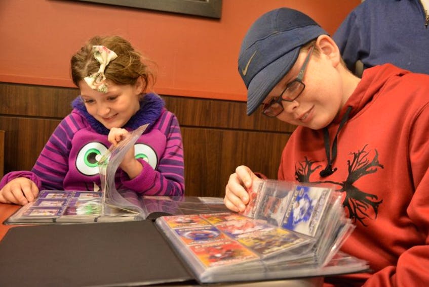<p>Tim Hortons NHL trading cards are a hot commodity these days and to celebrate that fact the franchise’s Water Street location in Summerside held a show and trade night on Thursday. Some of the more rare cards were being sold for as much as $50. Emma, 10 and Morgan MacLean, 12, might not have had that kind of bank roll to buy cards, but they still enjoyed their collection as much as anyone.&nbsp;</p>