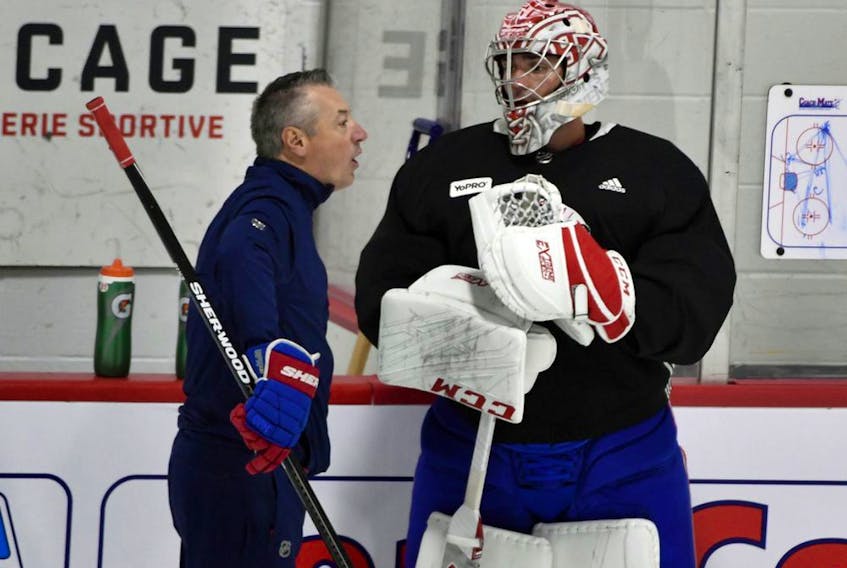 Montreal Canadiens goalie coach Stéphane Waite talks with Montreal Canadiens goalie Carey Price during a workout at the Bell Sports Complex in Brossard on July 21, 2020. 