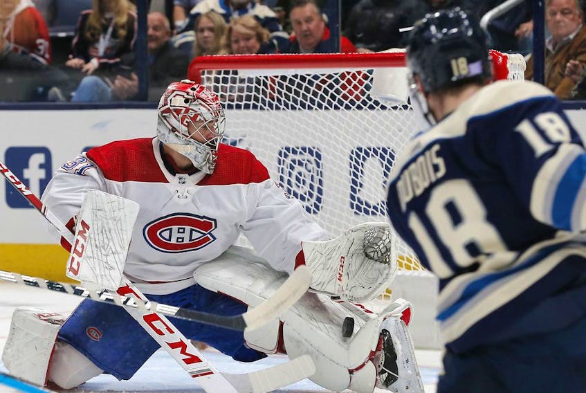  Canadiens goalie Carey Price makes a pad save from on Blue Jackets centre Pierre-Luc Dubois during first-period action Tuesday night.