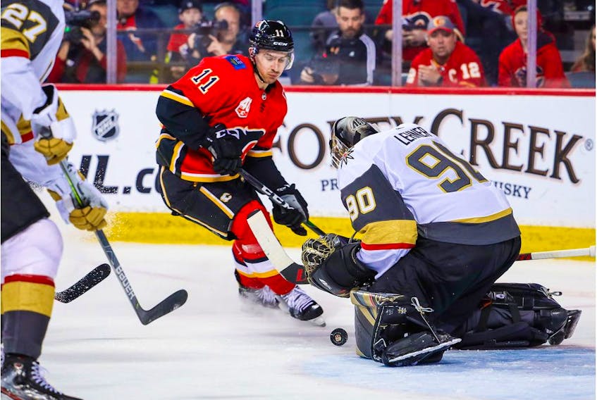 Mar 8, 2020; Calgary, Alberta, CAN; Vegas Golden Knights goaltender Robin Lehner (90) makes a save as Calgary Flames center Mikael Backlund (11) tries to score during the third period at Scotiabank Saddledome. Mandatory Credit: Sergei Belski-USA TODAY Sports ORG XMIT: USATSI-406054