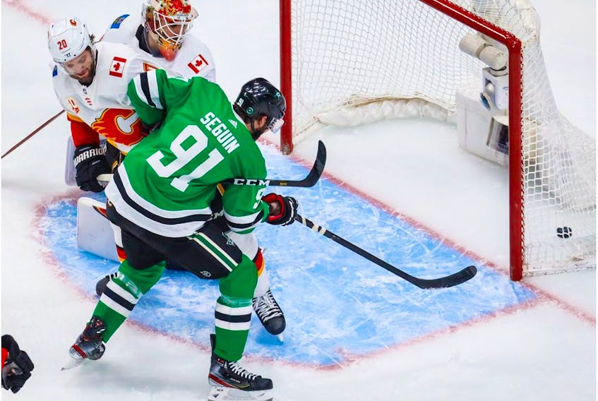 Dallas Stars centreman Tyler Seguin (No. 91) scores a goal against the Calgary Flames during the first period in Game 2 of the first round of the 2020 Stanley Cup Playoffs at Rogers Place.