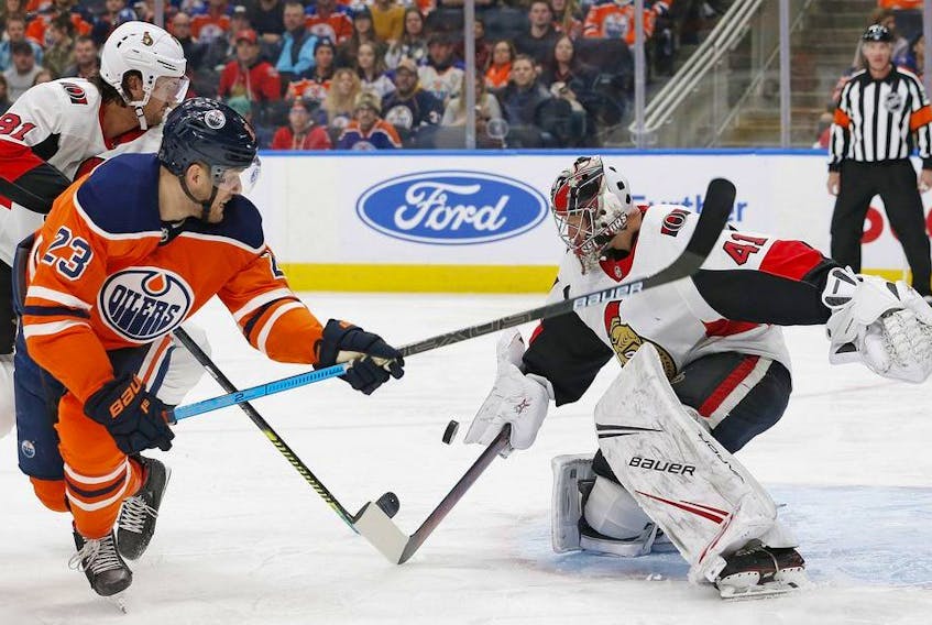 Ottawa Senators goaltender Craig Anderson makes a save on Edmonton Oilers forward Riley Sheahan during the first period at Rogers Place. 
